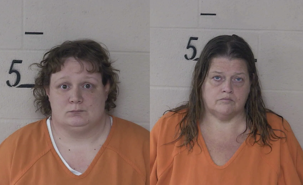 The image features two women in jail uniforms posing for identification photos, each set in front of a plain wall with a horizontal line and the number 5 visible behind them.